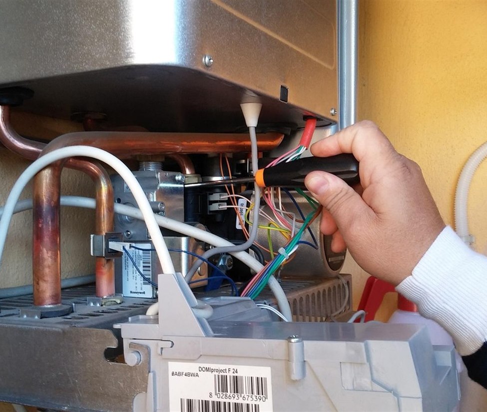 Gas engineer carrying out boiler servicing in Stoke-on-Trent